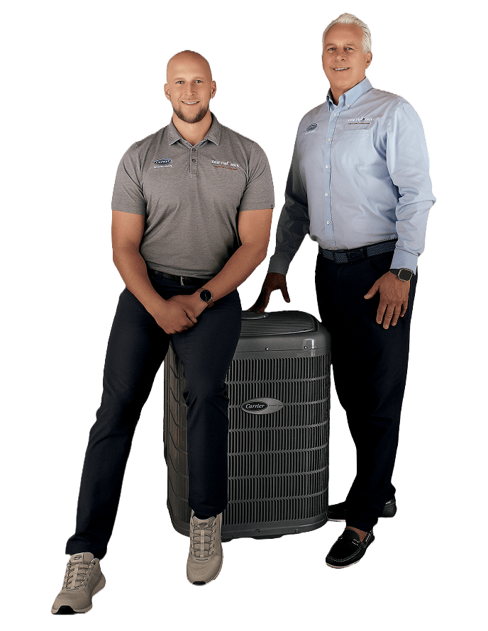 Two members of the Snazzy team beside an outdoor air conditioning unit