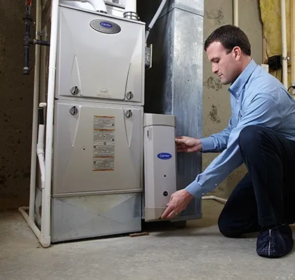 Snazzy technician servicing a residential furnace